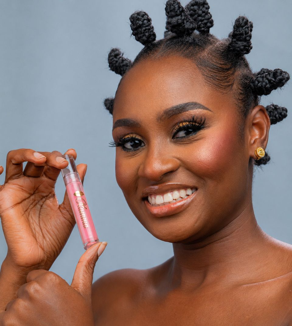 Smiling model holding Ama pink gloss